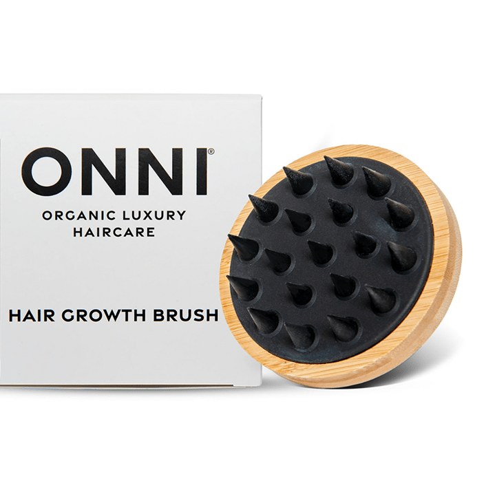 ONNI Hair Growth Brush with bamboo handle for scalp massage and improved blood circulation.